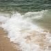 ocean waves crashing on shore during daytime